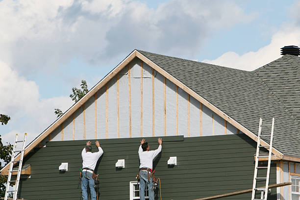 Professional Siding Installation technician working in Fayville, MA
